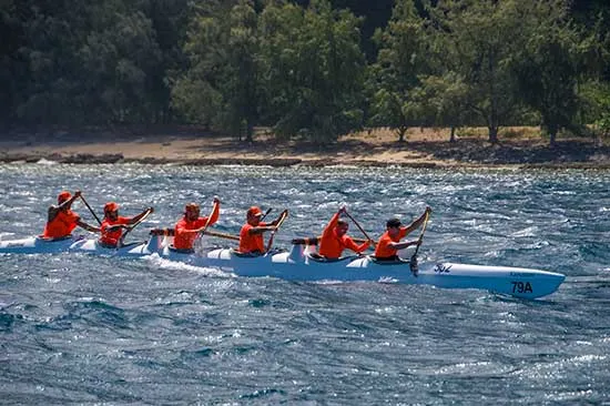 outrigger canoe being paddled